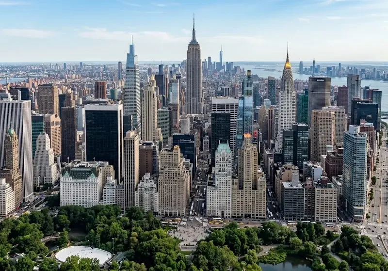Aerial view of Midtown Manhattan skyline in New York City with the Empire State Building and East River.